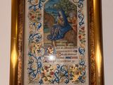painting of a woman on a horse in a gold frame on a wall