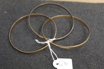 three rings with a price tag on them on a table