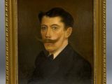 portrait d'un homme portant une moustache et une barbiche, dans un cadre doré
