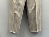 a close up of a pair of pants hanging on a wall