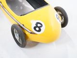 a yellow toy car with numbers on the front