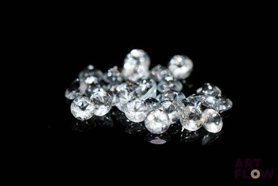 diamonds on a black surface with a black background