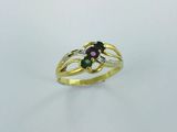 a close up of a gold ring with a green and pink stone