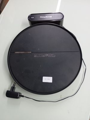 a black cd player sitting on top of a white table