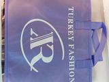a purple tote bag with a turkey fashion logo on it