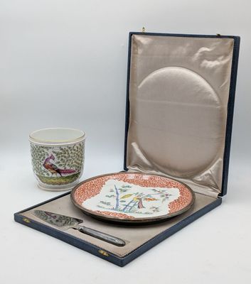 a plate and a cup in a box on a table