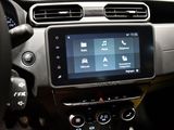 the dashboard of a car with a touch screen and steering wheel