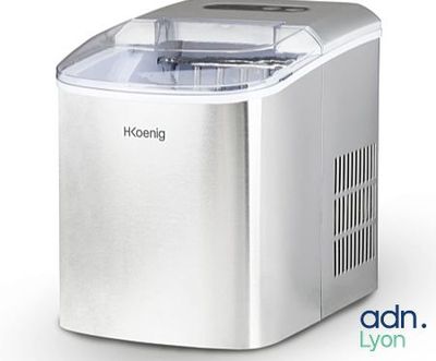 an image of a small ice maker sitting on top of a counter