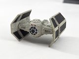 a close up of a star wars tier toy on a white surface
