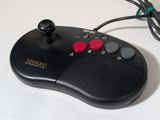 a close up of a game controller on a table