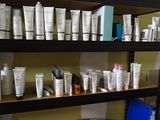 many different types of skin care products on the shelves