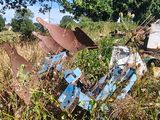 a motorcycle that is sitting in the grass near a tree
