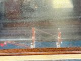 a picture of a miniature model of a ship in a glass case