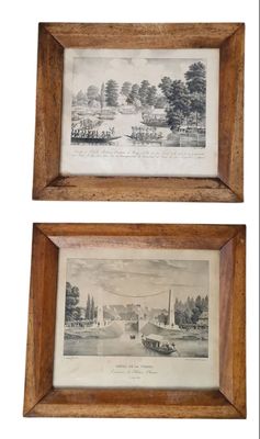 two framed prints of a view of a village and a river