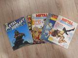 five comic books sitting on a wooden surface
