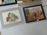 four paintings of fruit and vegetables on the wall