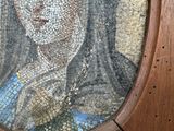 a picture of a mosaic of a woman on a wall