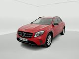 a red mercedes gla suv parked in a white room