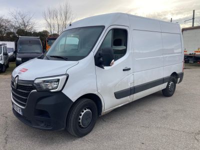 the white van is parked in a parking lot with other vehicles