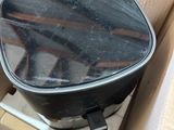 a box that has a black pan inside of it