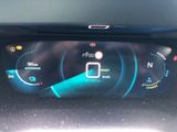 the dashboard of a car with a digital display on it