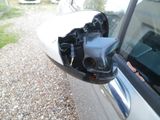 a side view mirror of a car with a car key in it