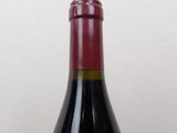 a bottle of wine that is sitting on a table