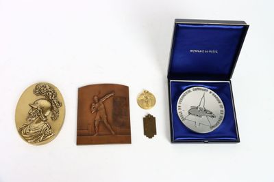 a gold medal and a silver medal in a blue box