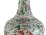 a vase with a dragon on it sitting on a table