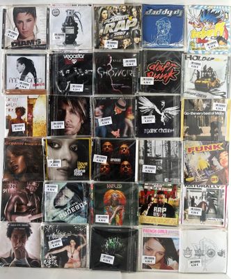 many different cd ' s on the wall of this room