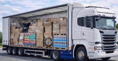 a truck with a trailer full of boxes on the back