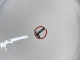 a white plate with a red circle on it