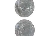 two clear glass bowls sitting next to each other