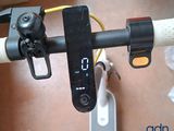 a close up of a bicycle handlebar with a clock on it
