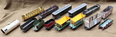 a lot of toy trains that are sitting on a table