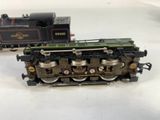 two toy trains sitting side by side on a white surface