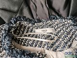 a close up of a sweater with a label on it