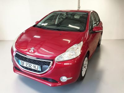a picture of a red car parked in a garage
