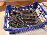 a blue basket that has a bunch of train tracks in it