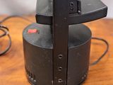 a black television sitting on top of a wooden table