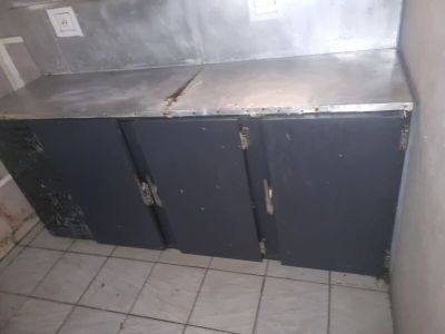 an image of a kitchen with a metal counter top