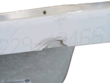 a close up of a white sink with a hole in it