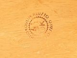 a close up of a wooden table with a clock on it