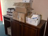 many boxes stacked on top of each other on a table