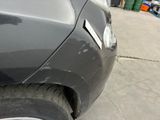 a close up of a car that has a dent in it