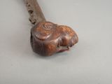 a wooden stick that has a face on it