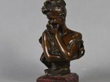 bronze statue of a woman holding her hand to her chin