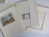 a pile of cards with pictures on them sitting on a table