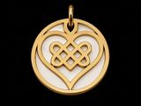 a gold plated celtic heart pendant on a black background