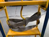 a yellow ladder with a gray belt on it